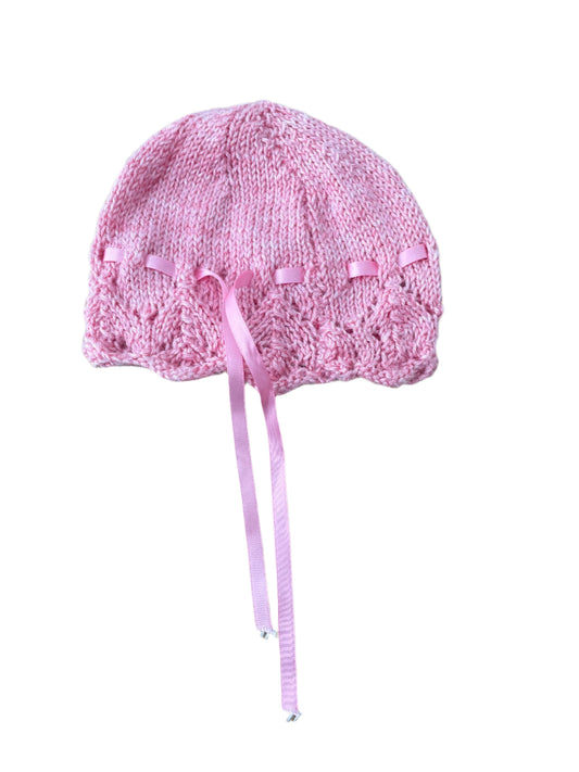 Roze wollen muts met pluisjes