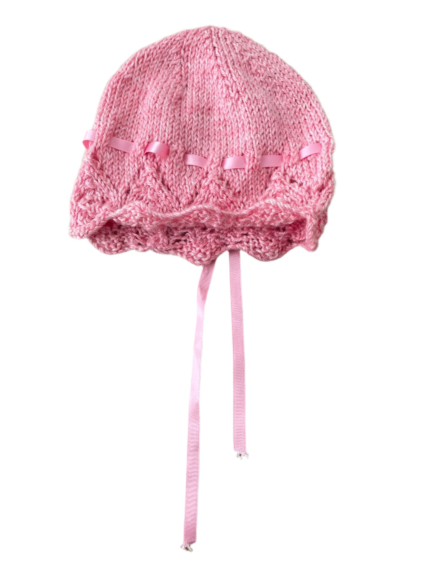 Roze wollen muts met pluisjes