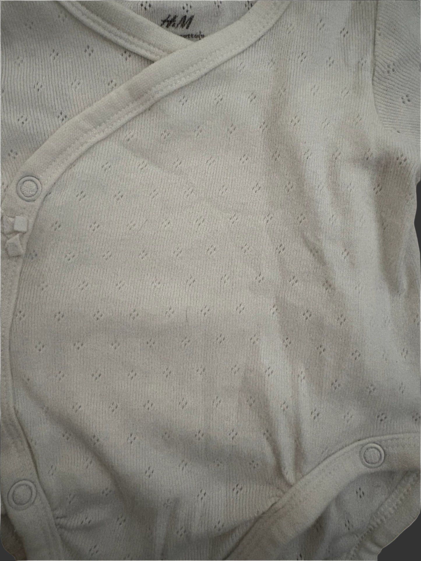 Close-up of white baby onesie