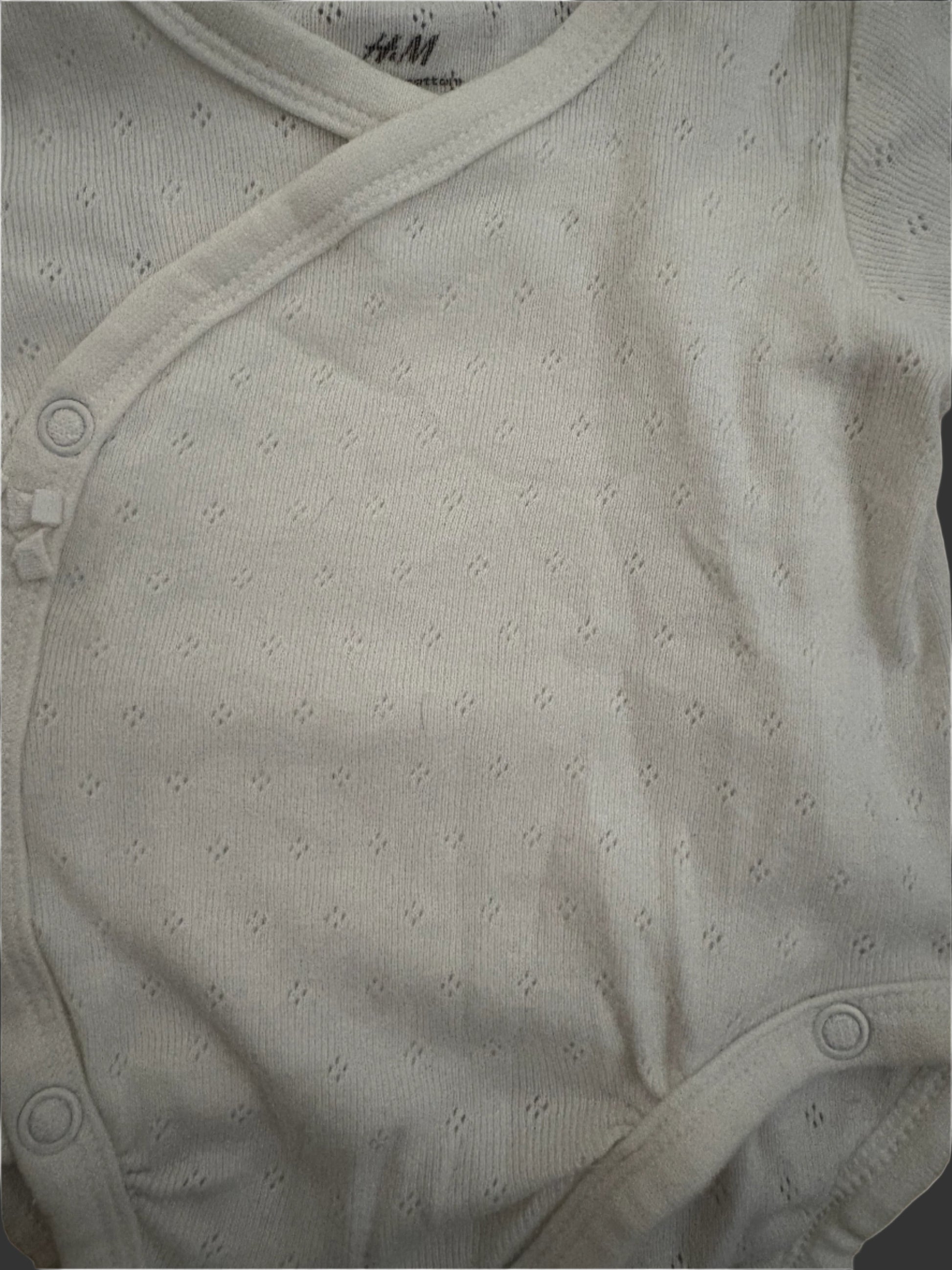 Close-up of white baby onesie
