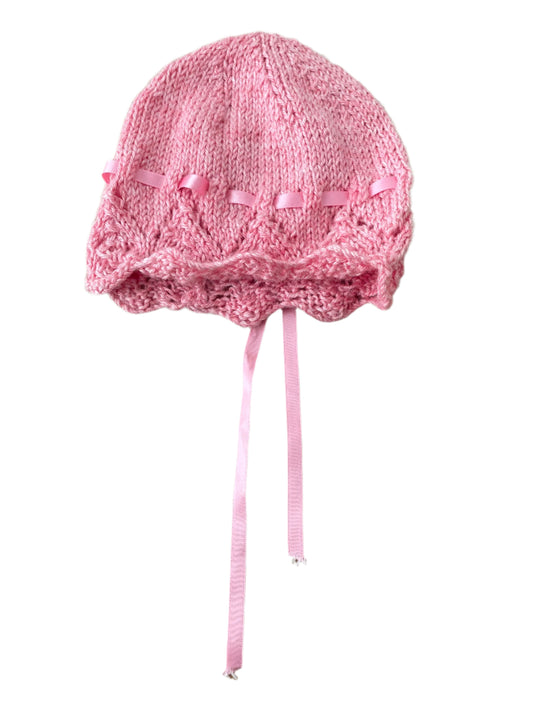 Roze wollen muts met pluisjes