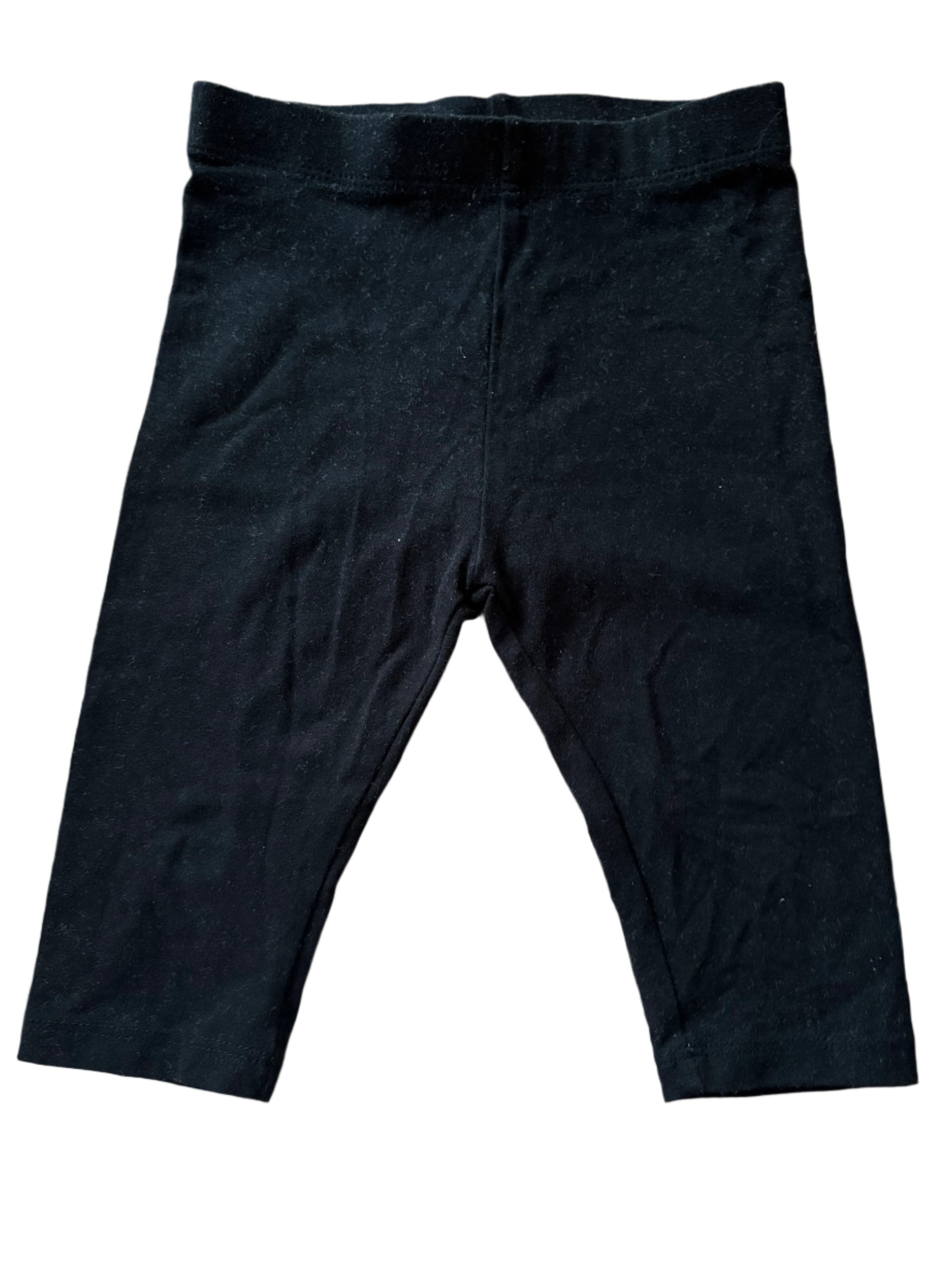 Black pants on a wooden surface