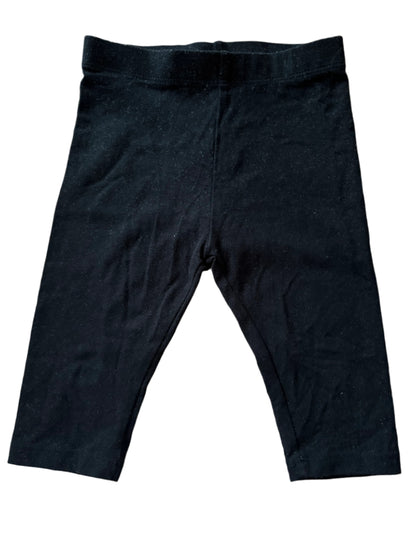 Black pants on a wooden surface