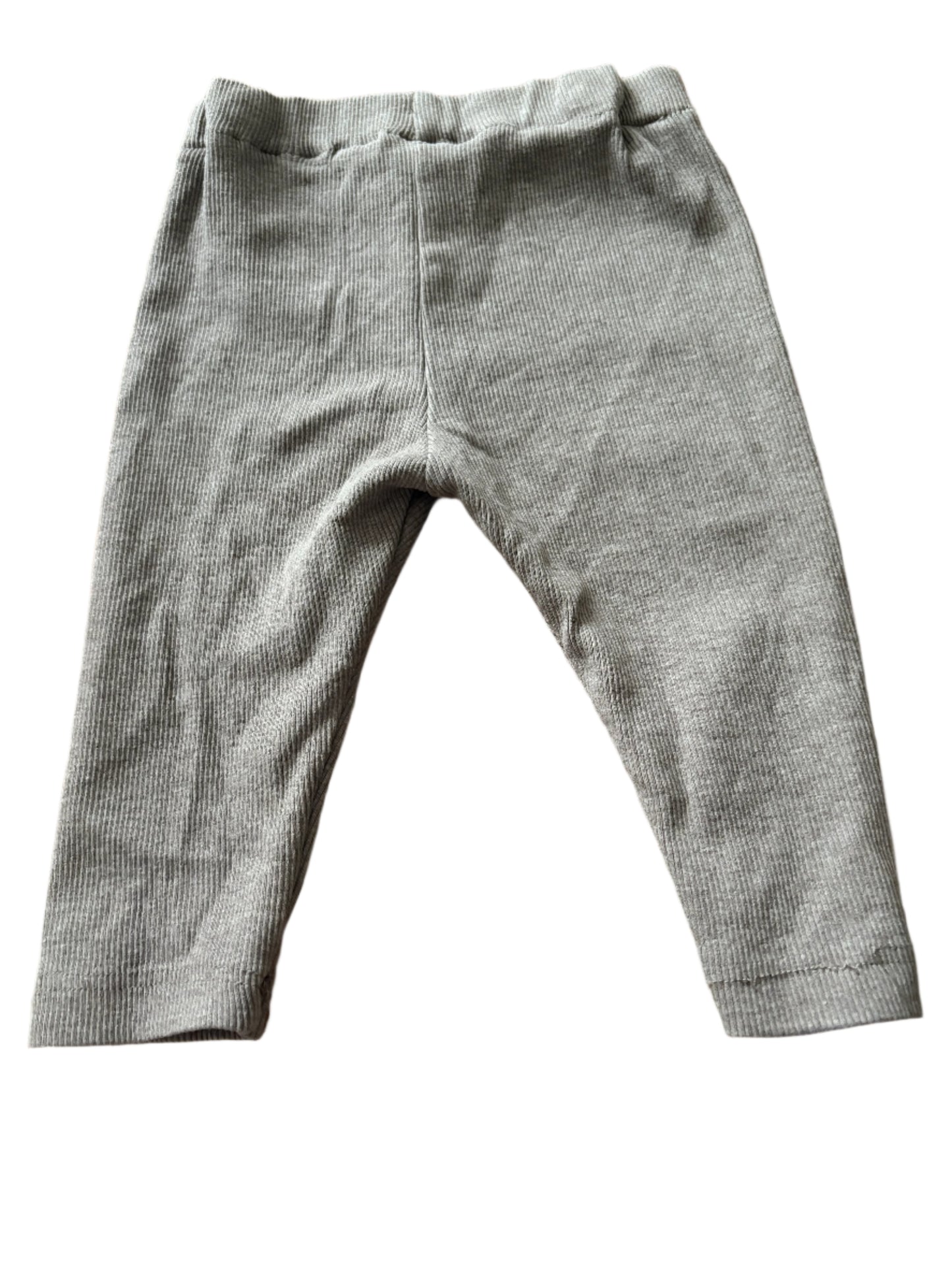 Gray pants on a wooden surface