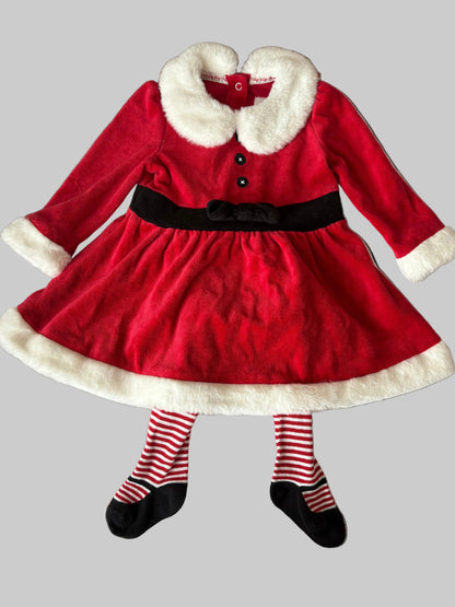 Red dress with white fur collar and black belt, paired with striped tights and shoes