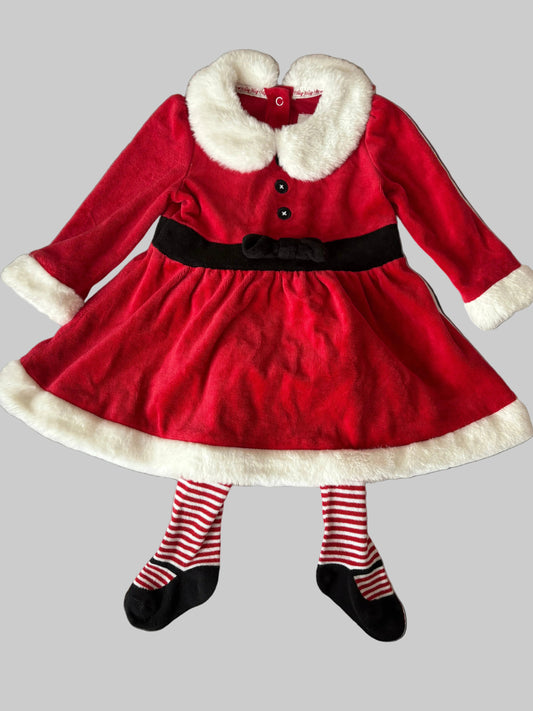 Red dress with white fur collar and black belt, paired with striped tights and shoes