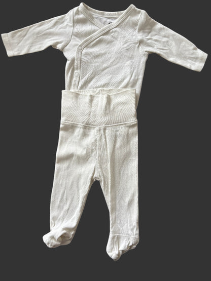 White baby bodysuit and pants
