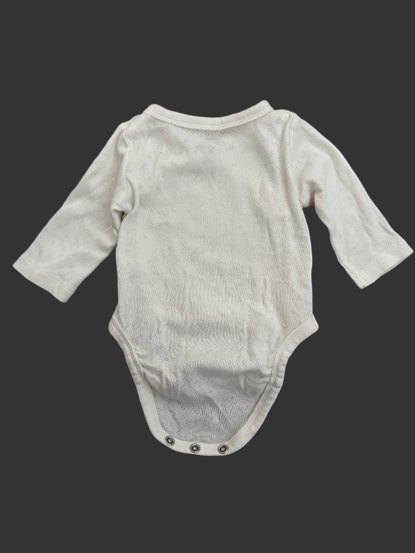 white baby onesie with long sleeves back
