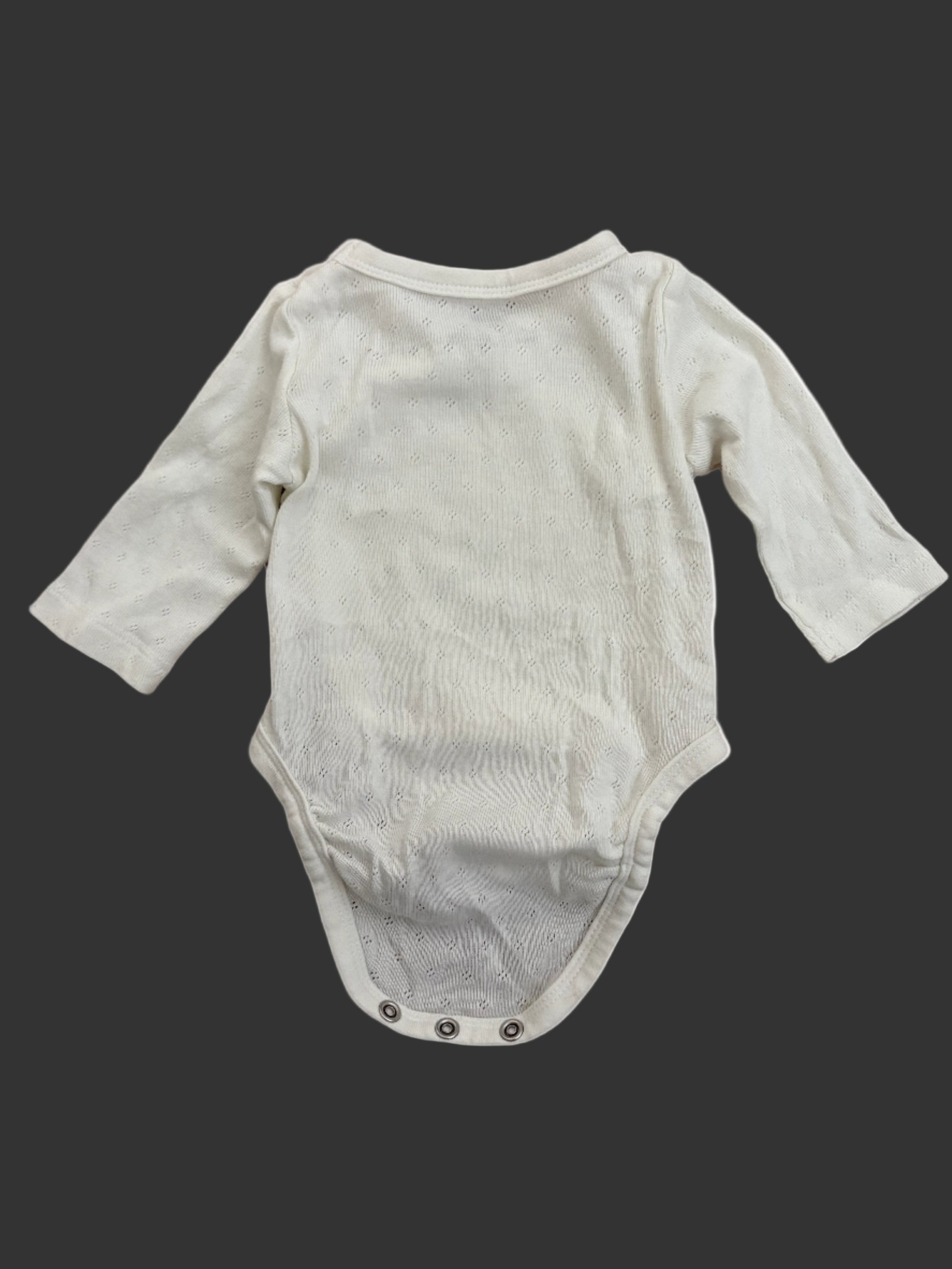 white baby onesie with long sleeves back