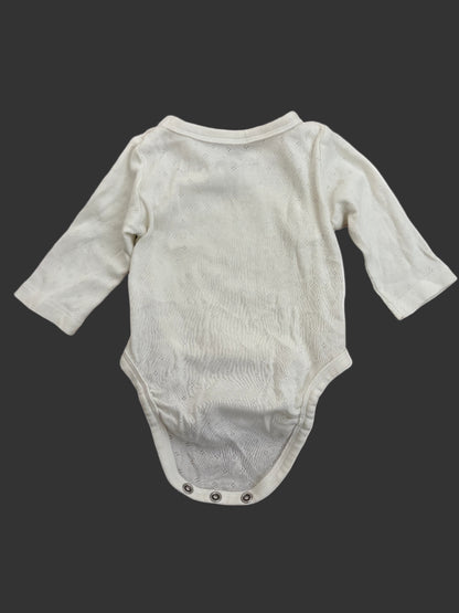 white baby onesie with long sleeves back